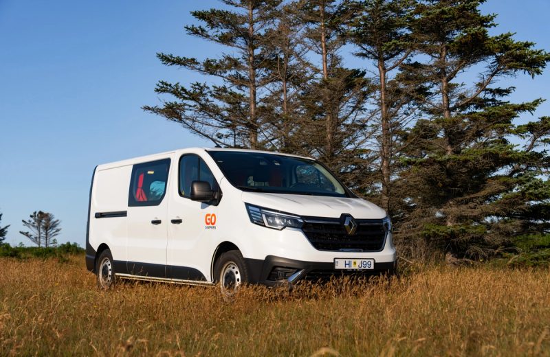 Go LITE Automatic heated campervan parked beside evergreen trees in Iceland